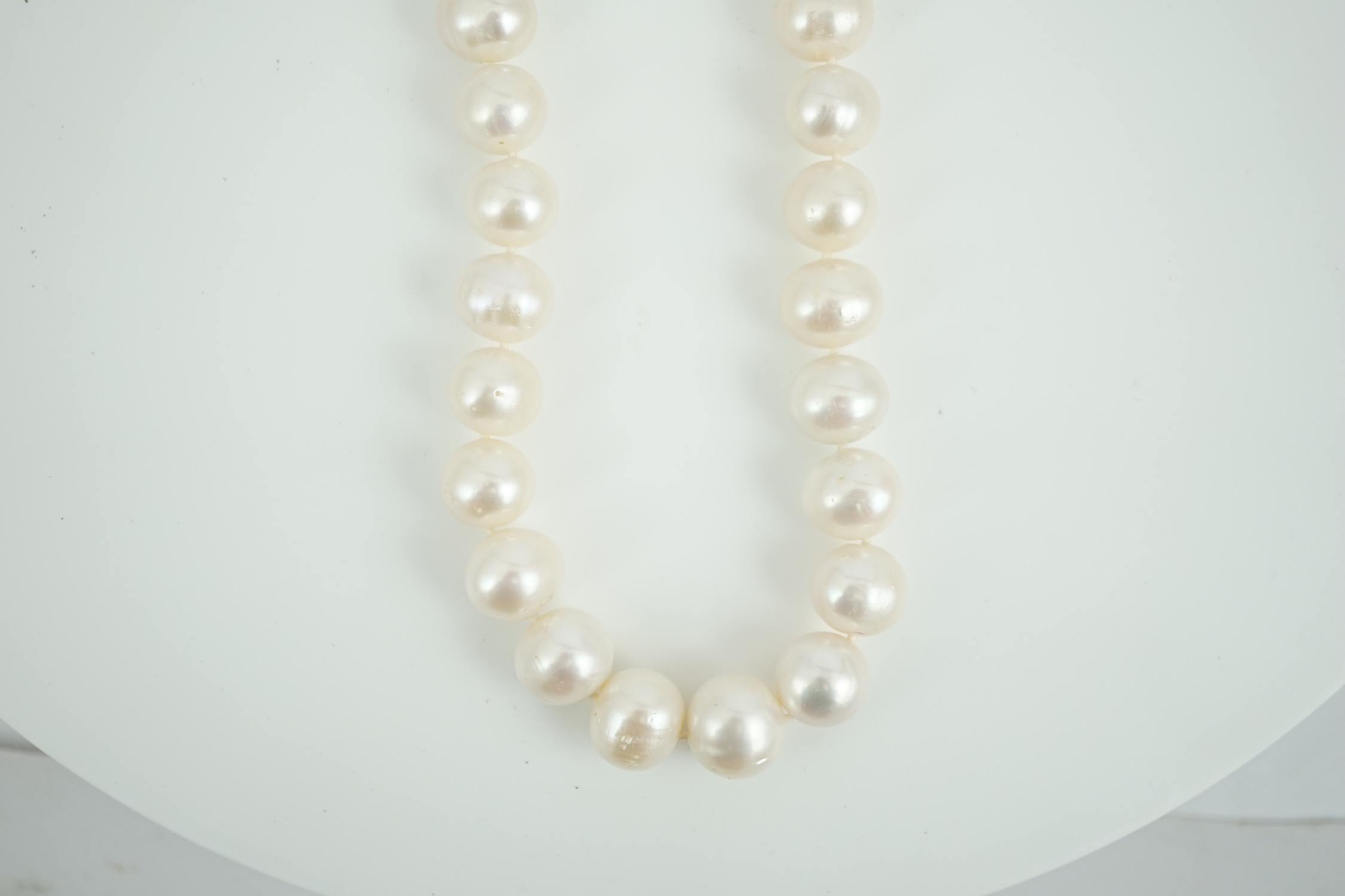 A single strand South Sea? cultured pearl necklace, with 14k yellow metal clasp, 44cm